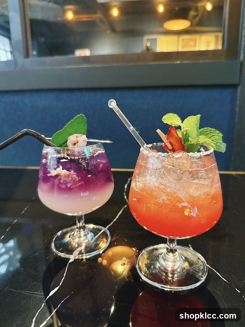 Two Colorful Cocktails on a Table