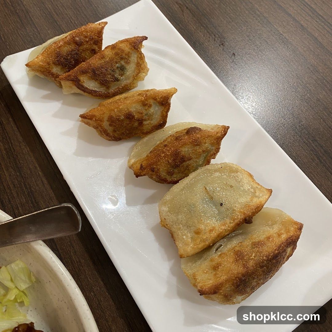 Pan-Fried Dumplings on a White Plate