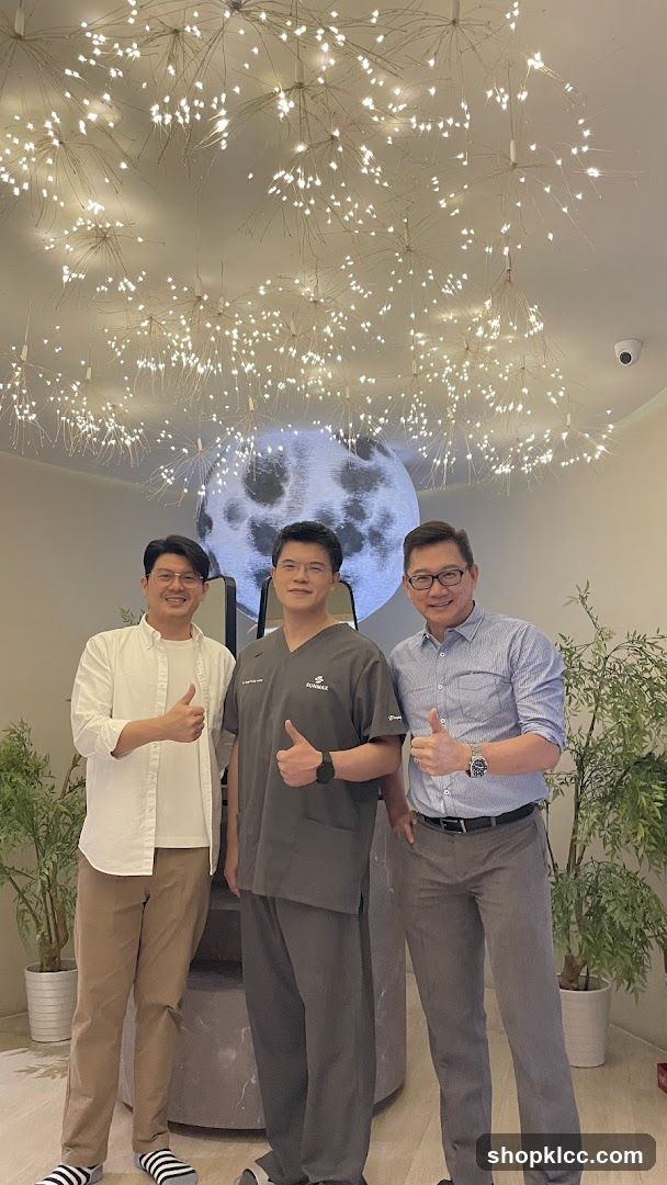 Three men giving thumbs up in a modern interior