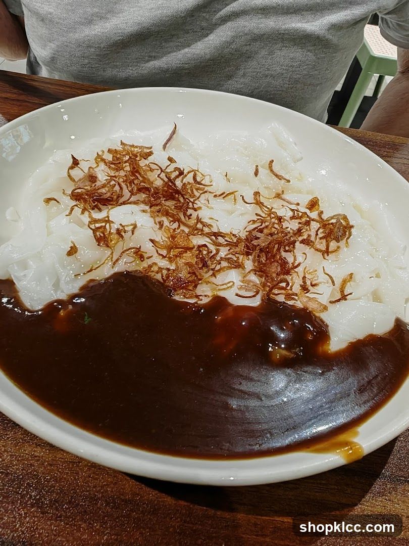 Noodle Dish with Sauce and Crispy Toppings