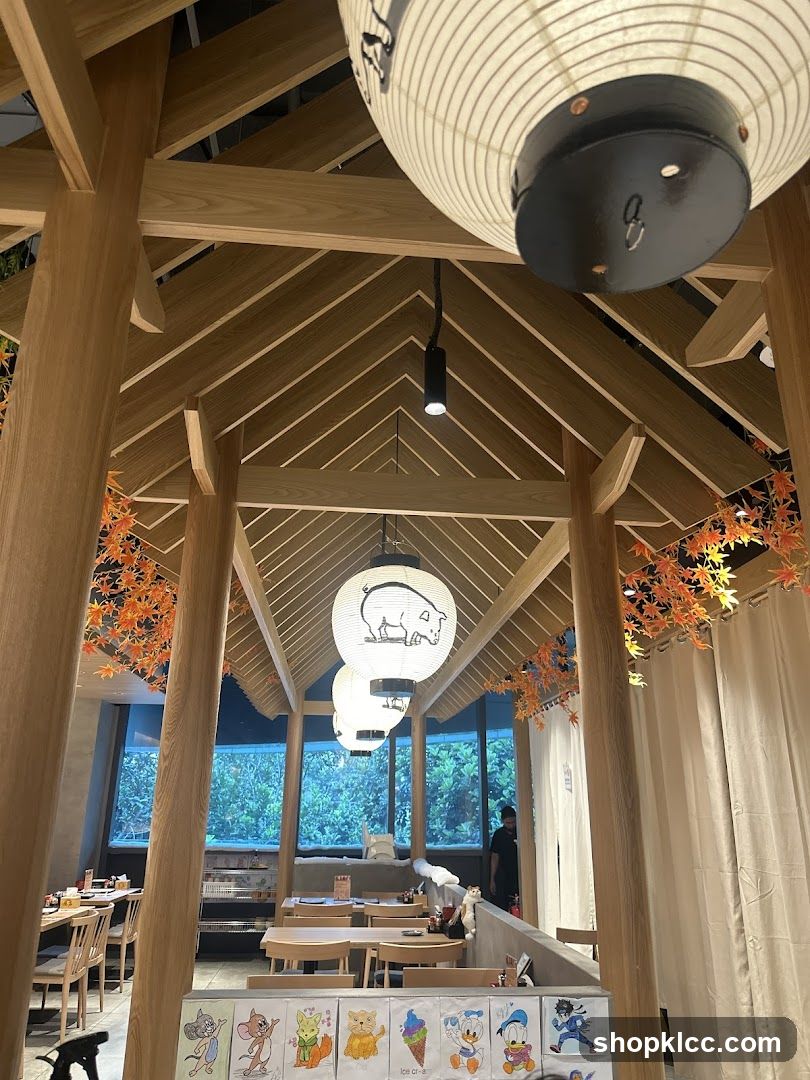 Interior of a Japanese-style restaurant with wooden beams and lanterns