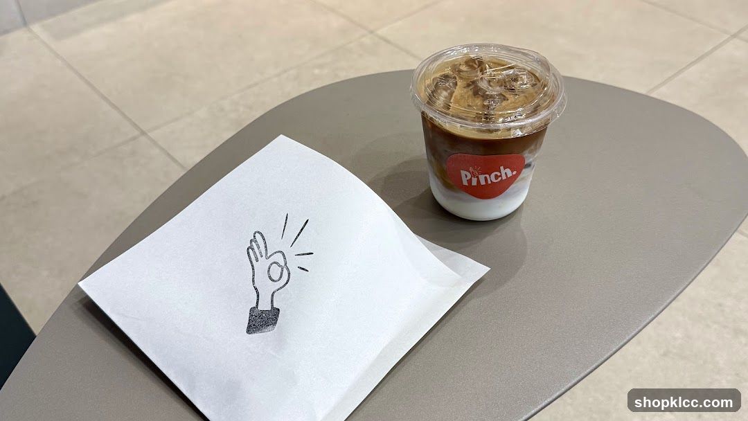 Iced Coffee and Napkin on Table