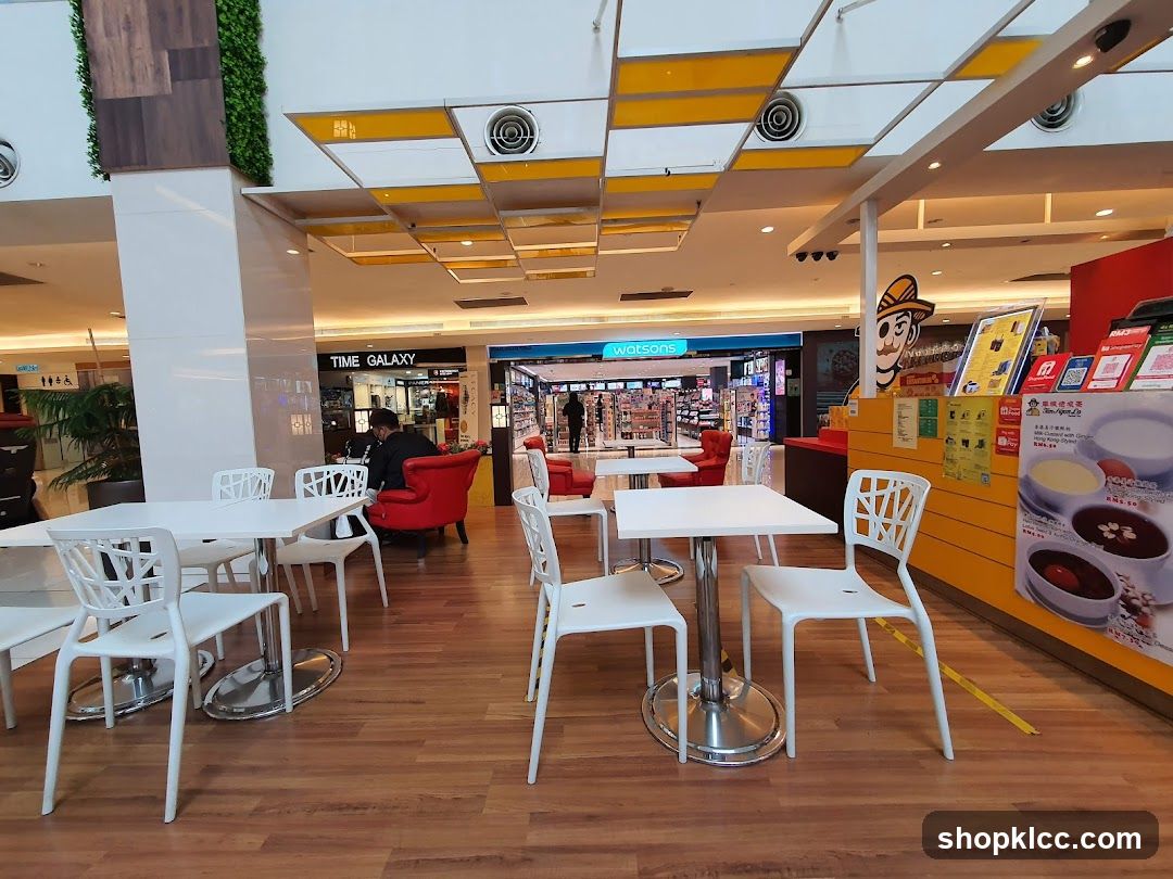 Shopping Mall Interior with Seating Area and Storefronts