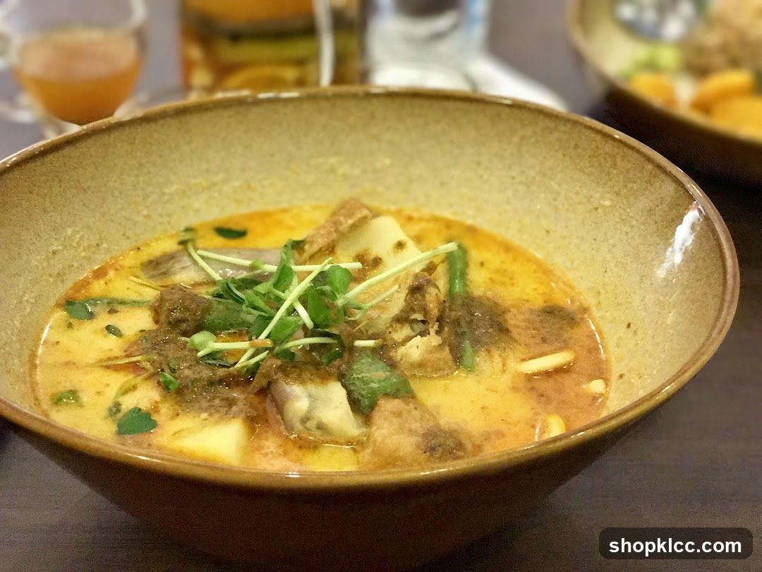 Bowl of Curry Soup with Tofu and Greens