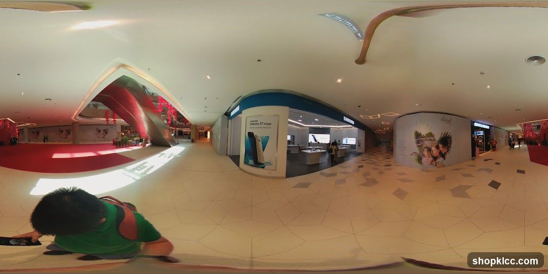 Mall Interior with Storefronts and Advertisements