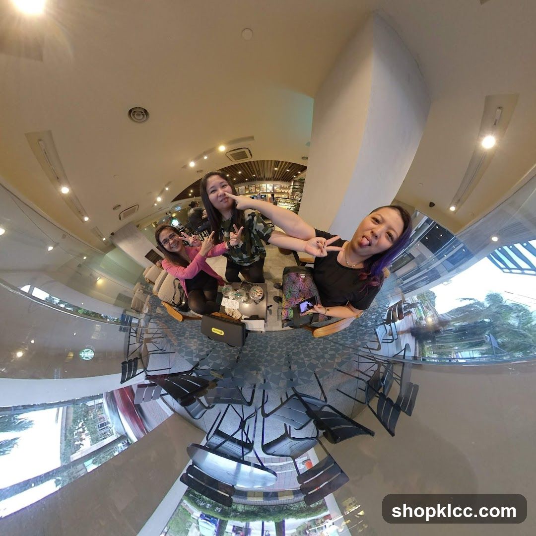 Three friends posing for a photo in a cafe