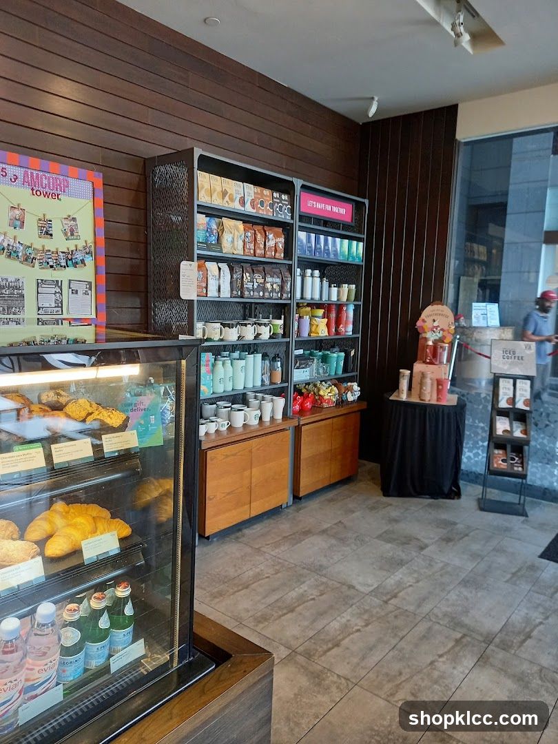 Coffee shop interior with display shelves and refrigerated case