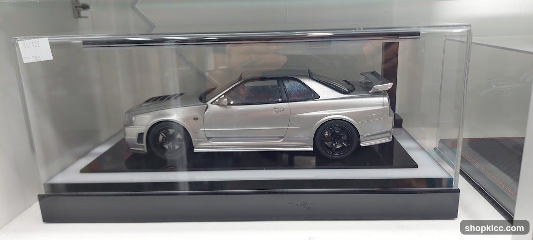 Die-cast model car in display case