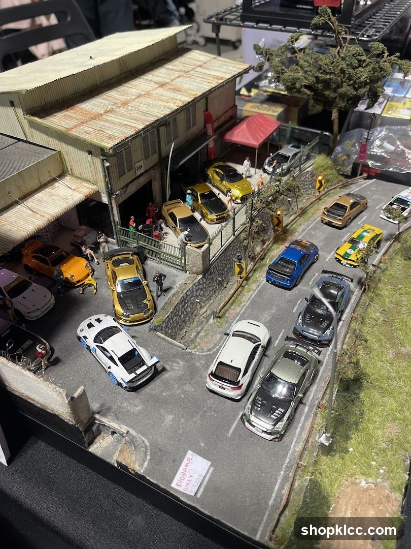 Diorama of a street scene with miniature cars