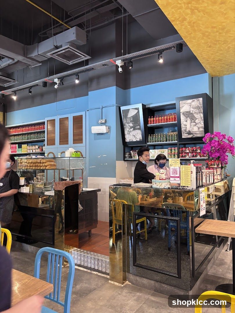 Restaurant Interior with Staff and Shelves of Goods