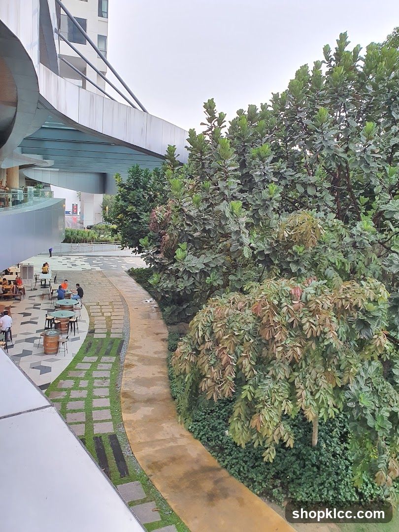 Outdoor seating area with greenery and modern architecture