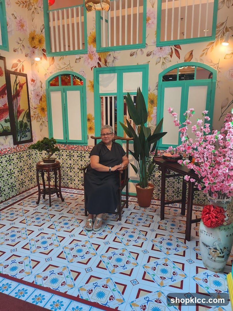 Interior of a decorated room with floral wallpaper and patterned tiles