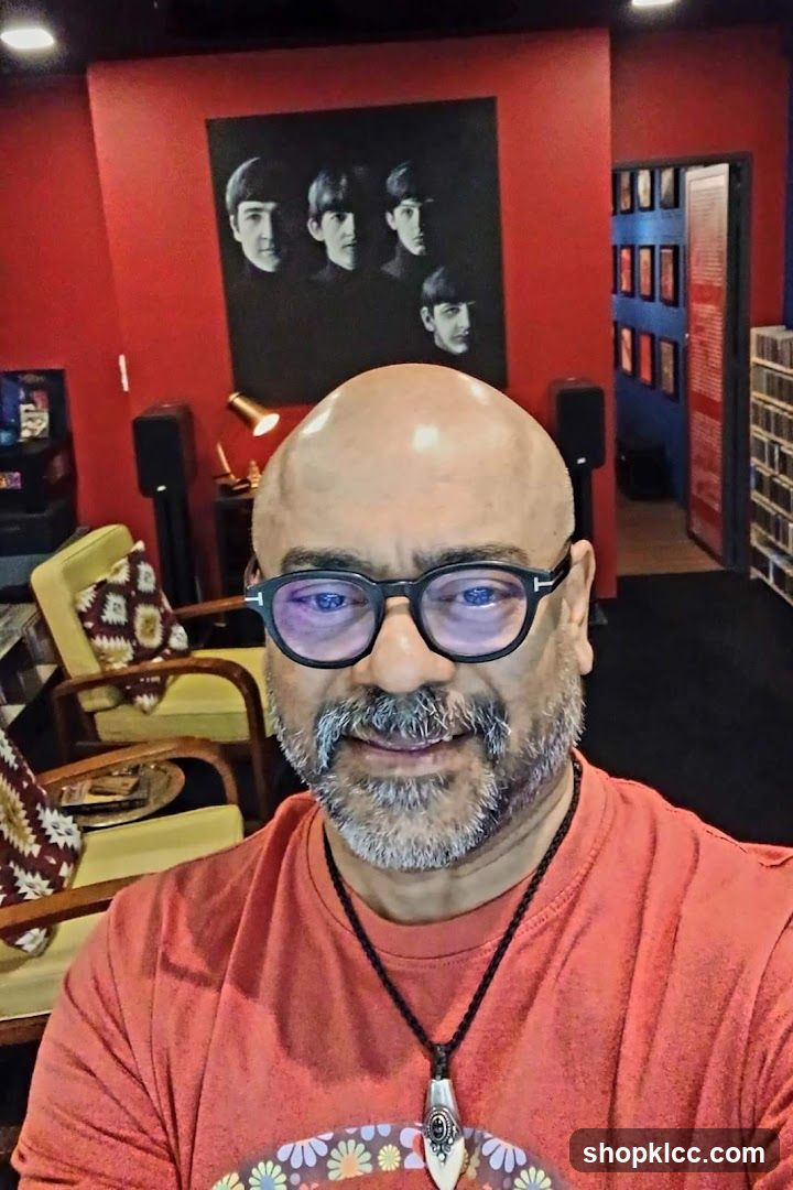 Man in a room with Beatles memorabilia