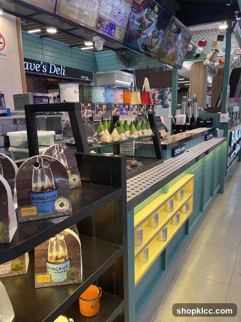 Food stall counter with packaged goods and menu boards