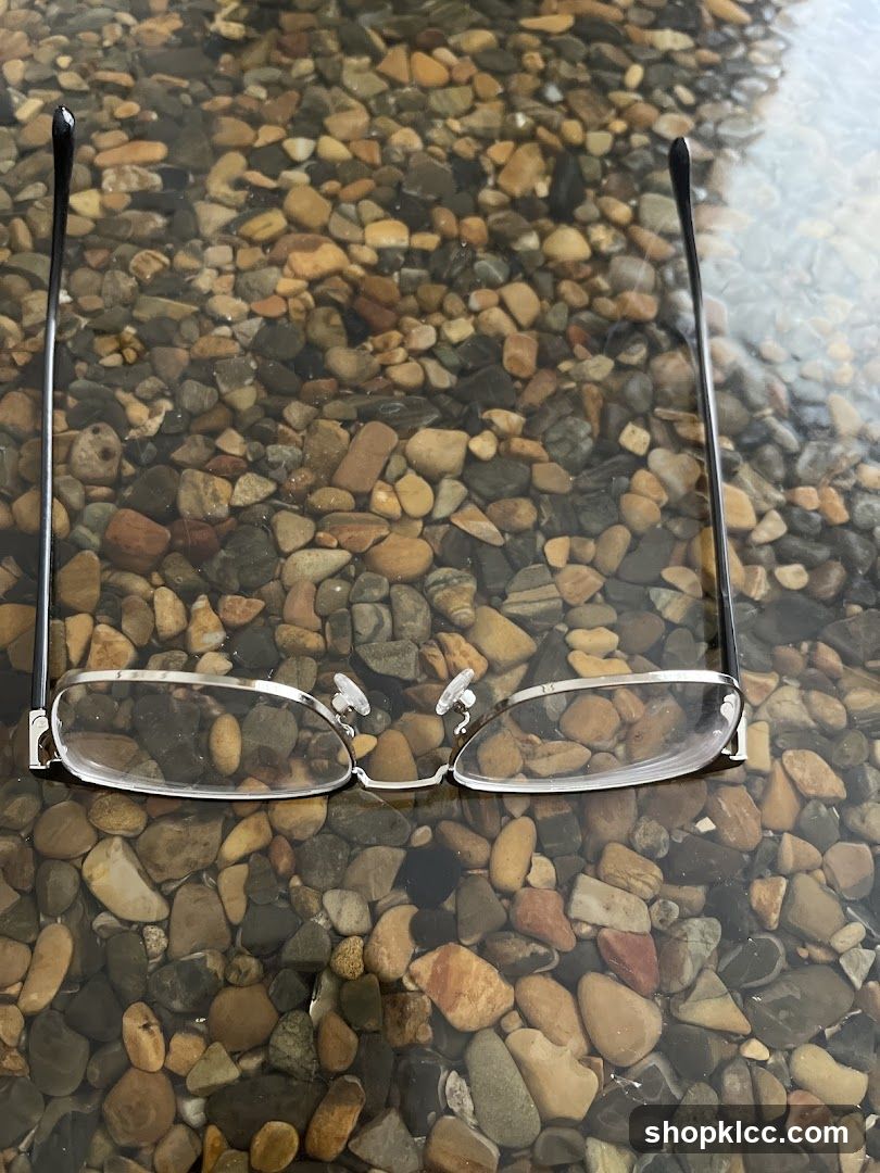 Eyeglasses on a pebble surface