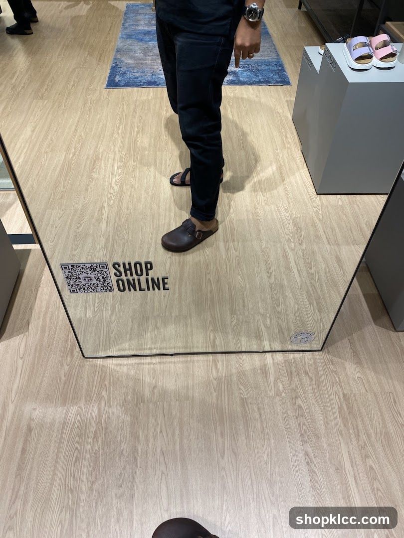 Mirror reflection of shoes and store interior