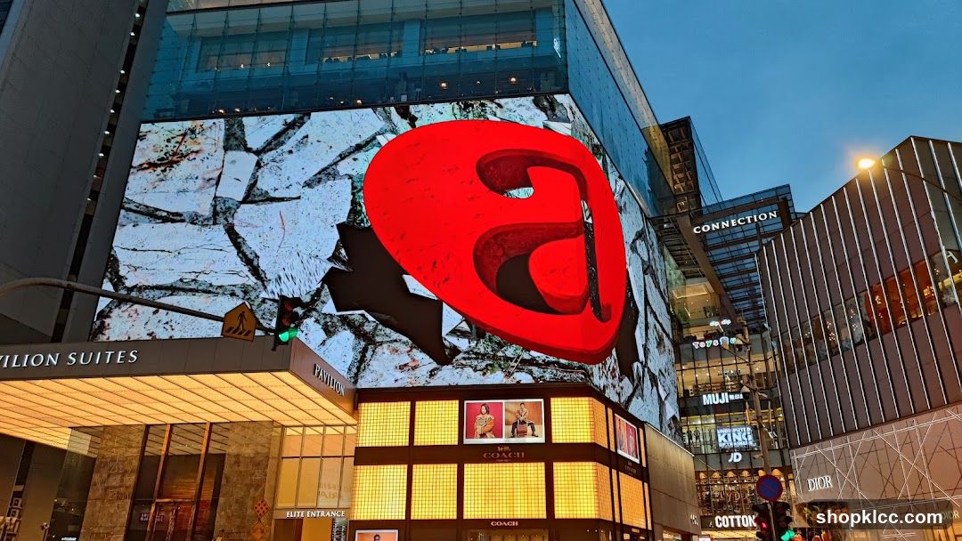 Large Red Logo on Building Facade