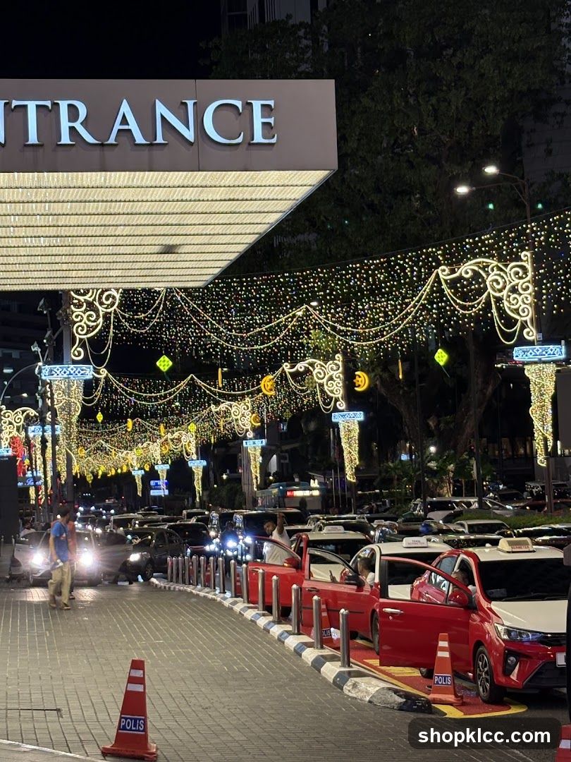 Nighttime street scene with festive lights and traffic