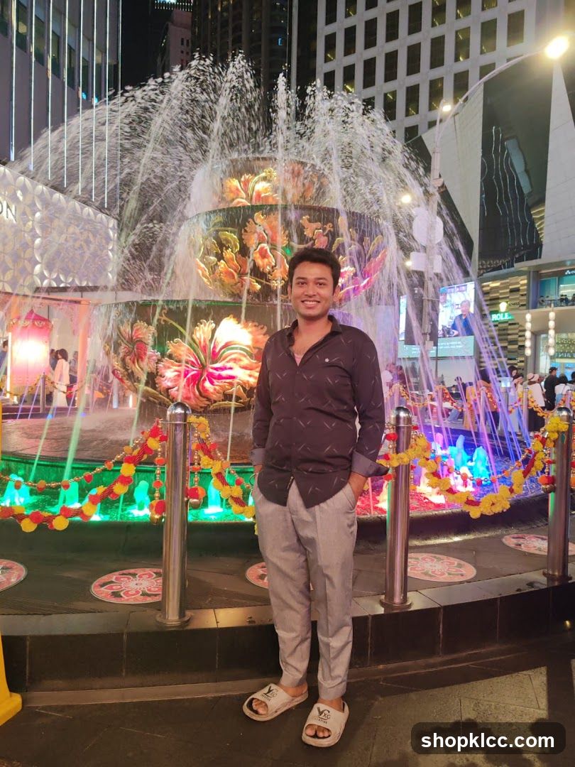 Man Posing in Front of a Fountain