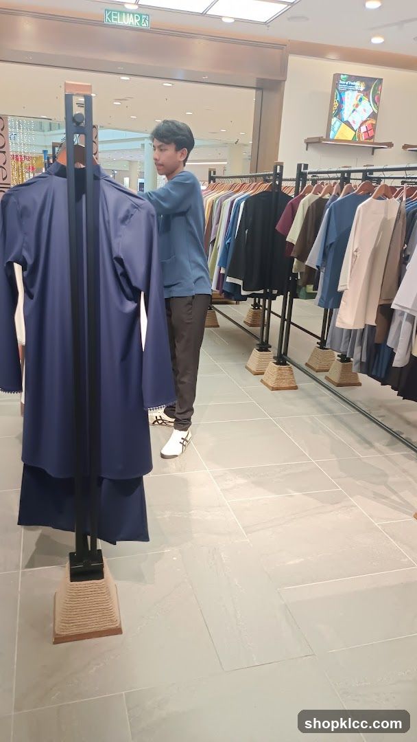 Man browsing clothes in a store