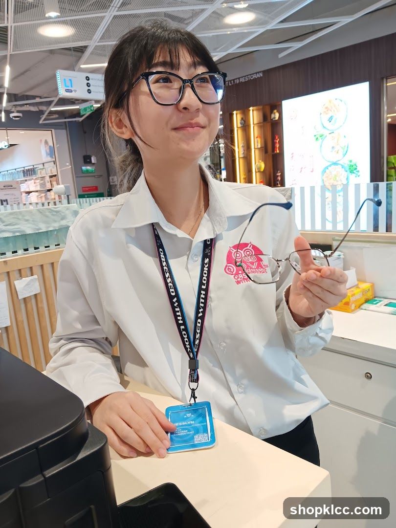 Optician holding glasses