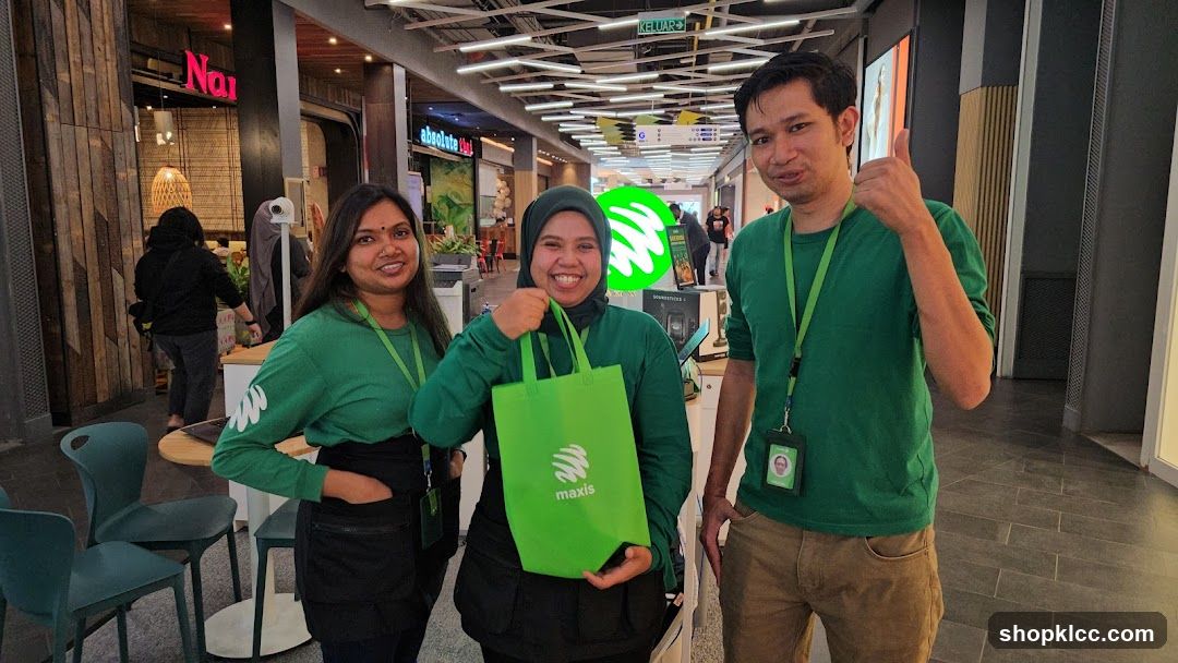 Three people in green shirts