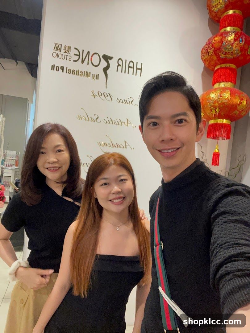 Three people smiling in a salon