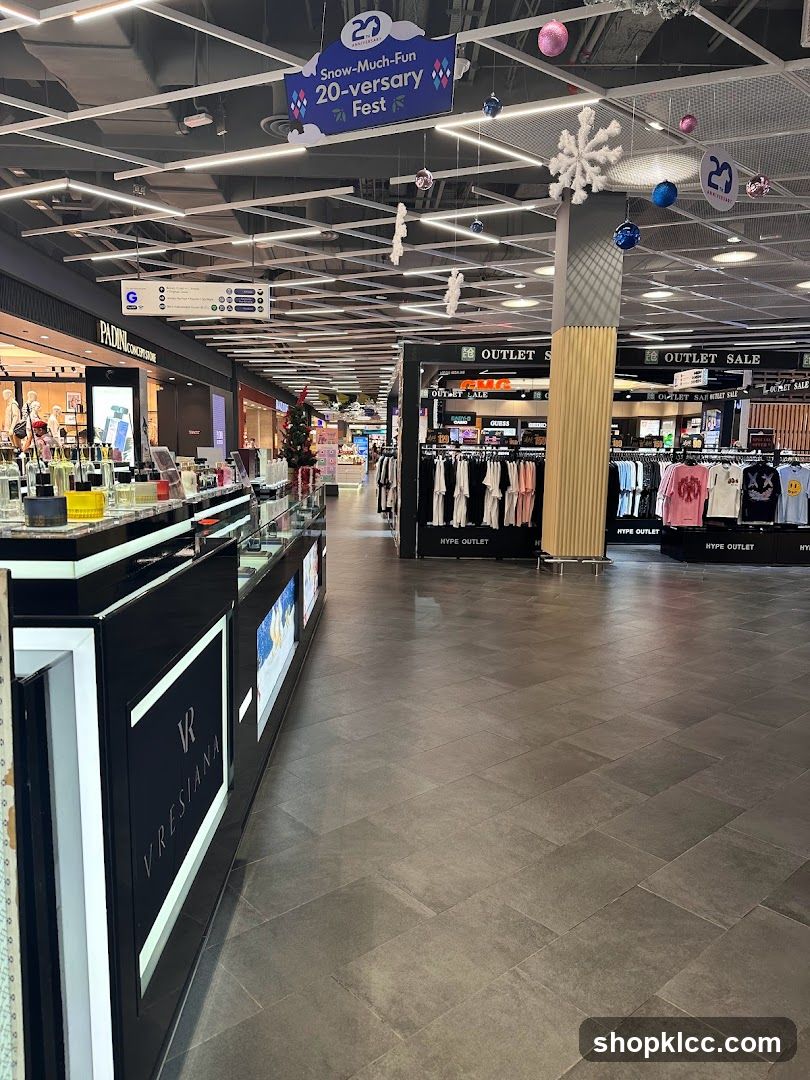 Indoor shopping mall aisle with various stores