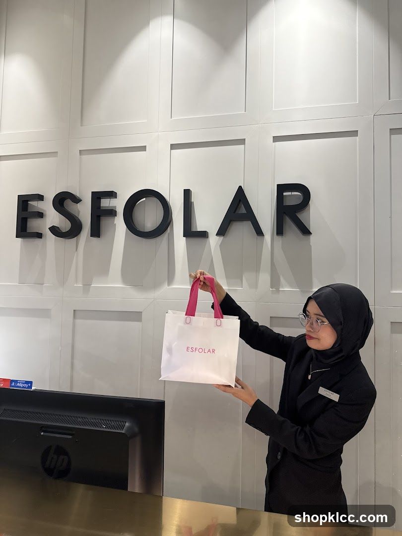 Employee holding a shopping bag