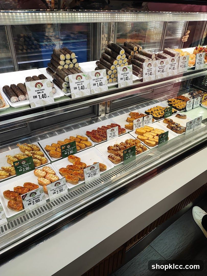 Sushi and other food items in a display case