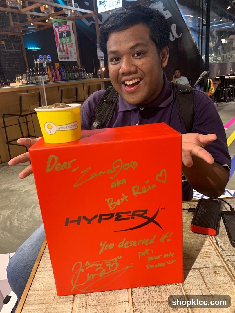 Man with a HyperX box and ice cream