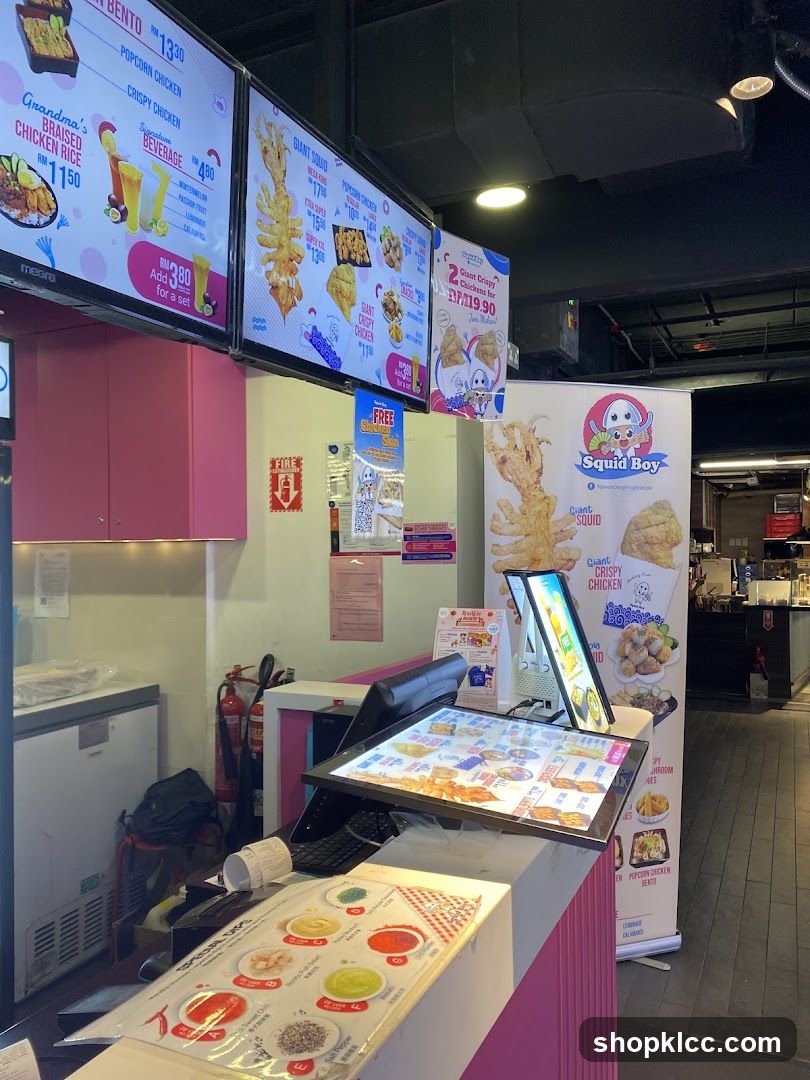 Food counter with digital menus and promotional posters