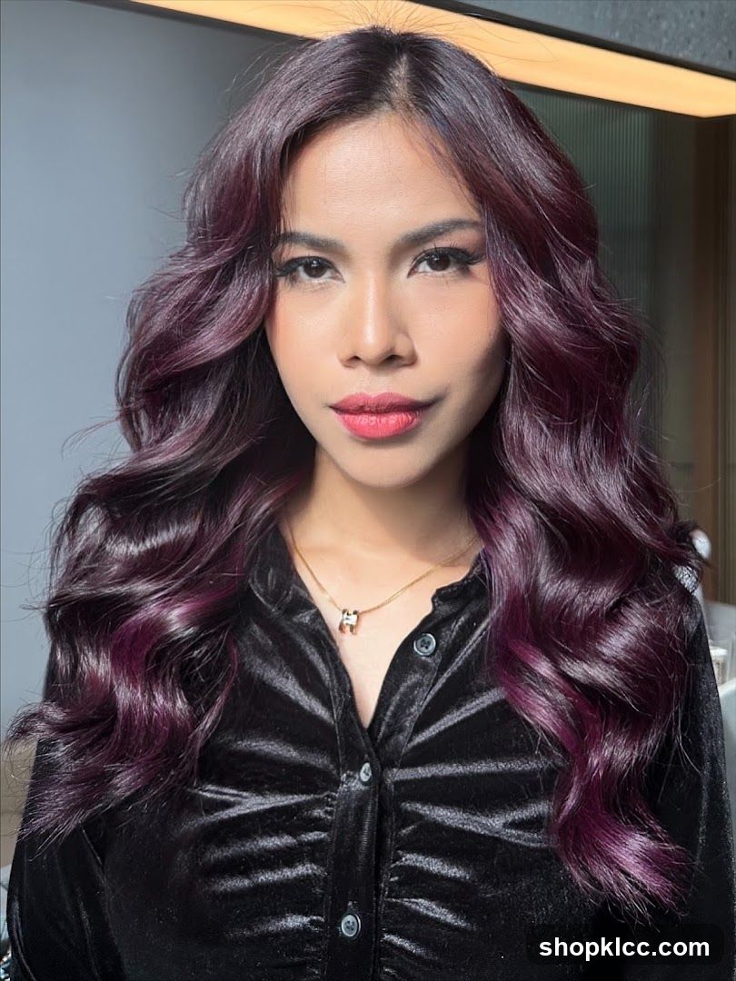 Woman with dark purple wavy hair