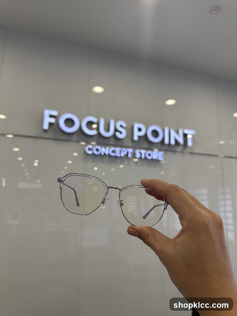 Eyeglasses in front of store sign
