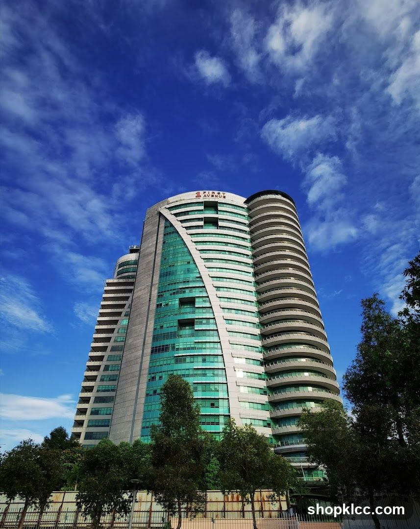Modern High-Rise Building with Blue Sky Background