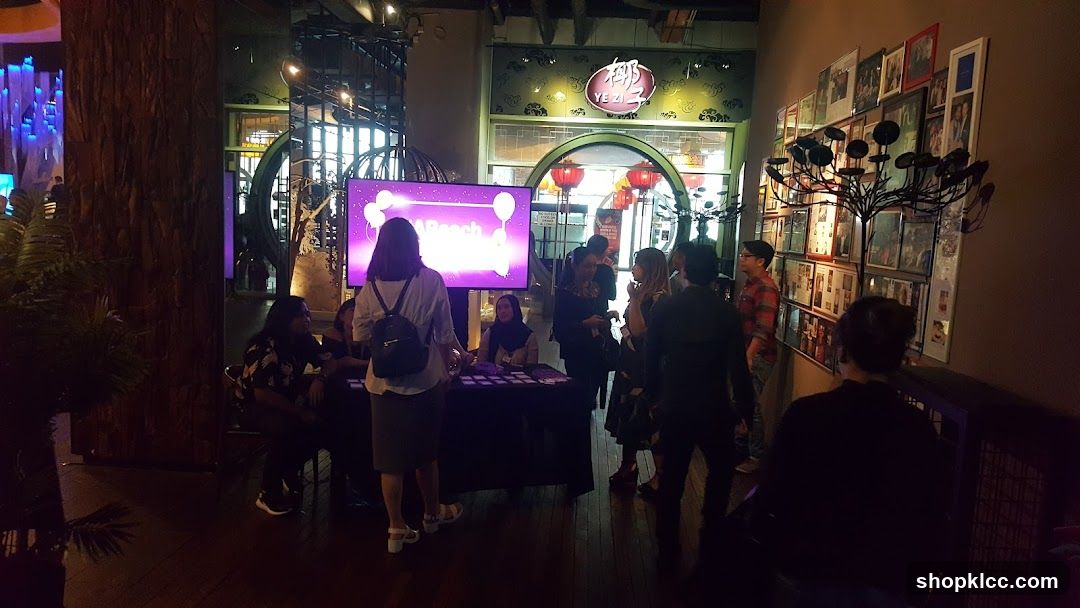 Event Booth with Screen and Crowd