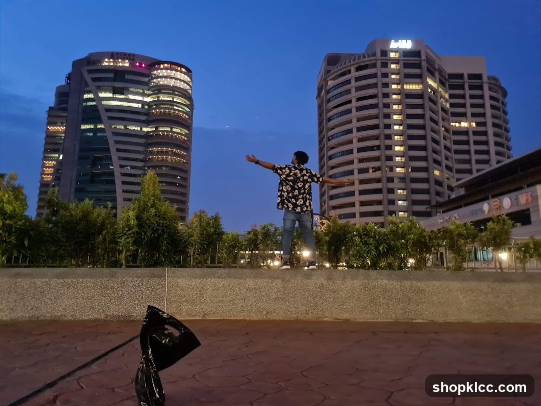 Evening Cityscape with Person on Wall