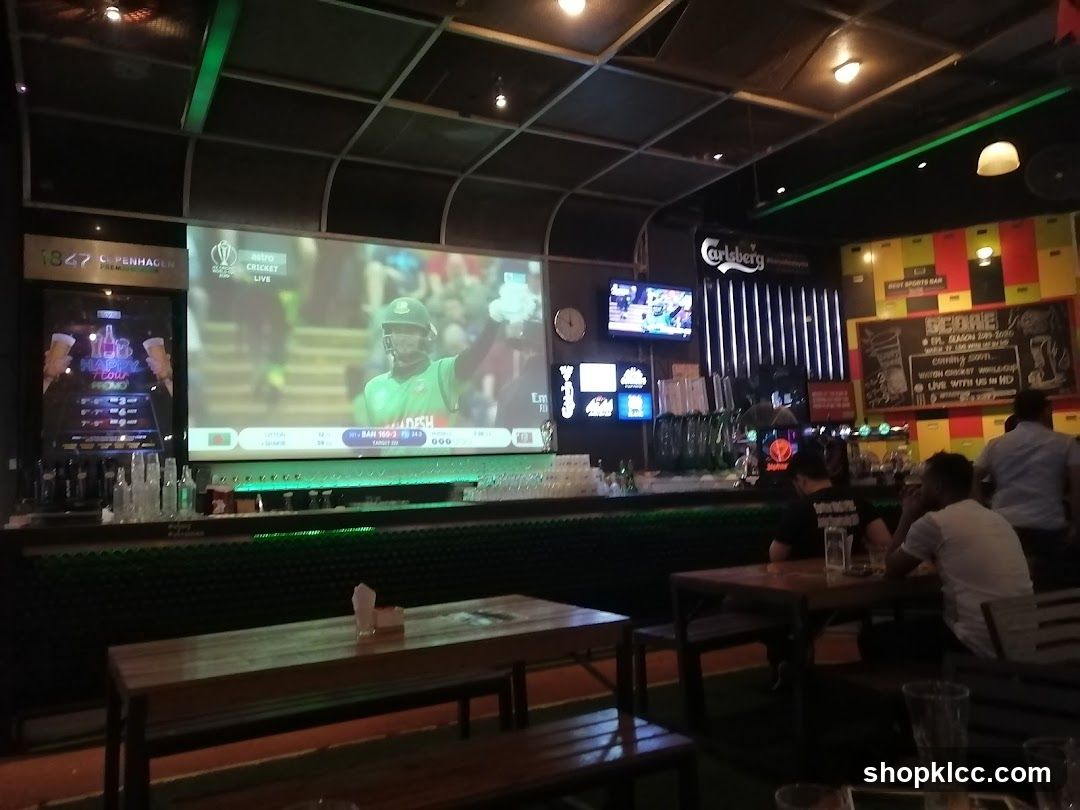 Bar Interior with Cricket Match on Screen