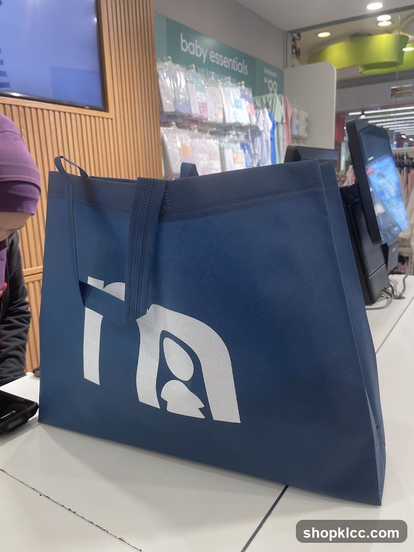Blue shopping bag with logo on store counter