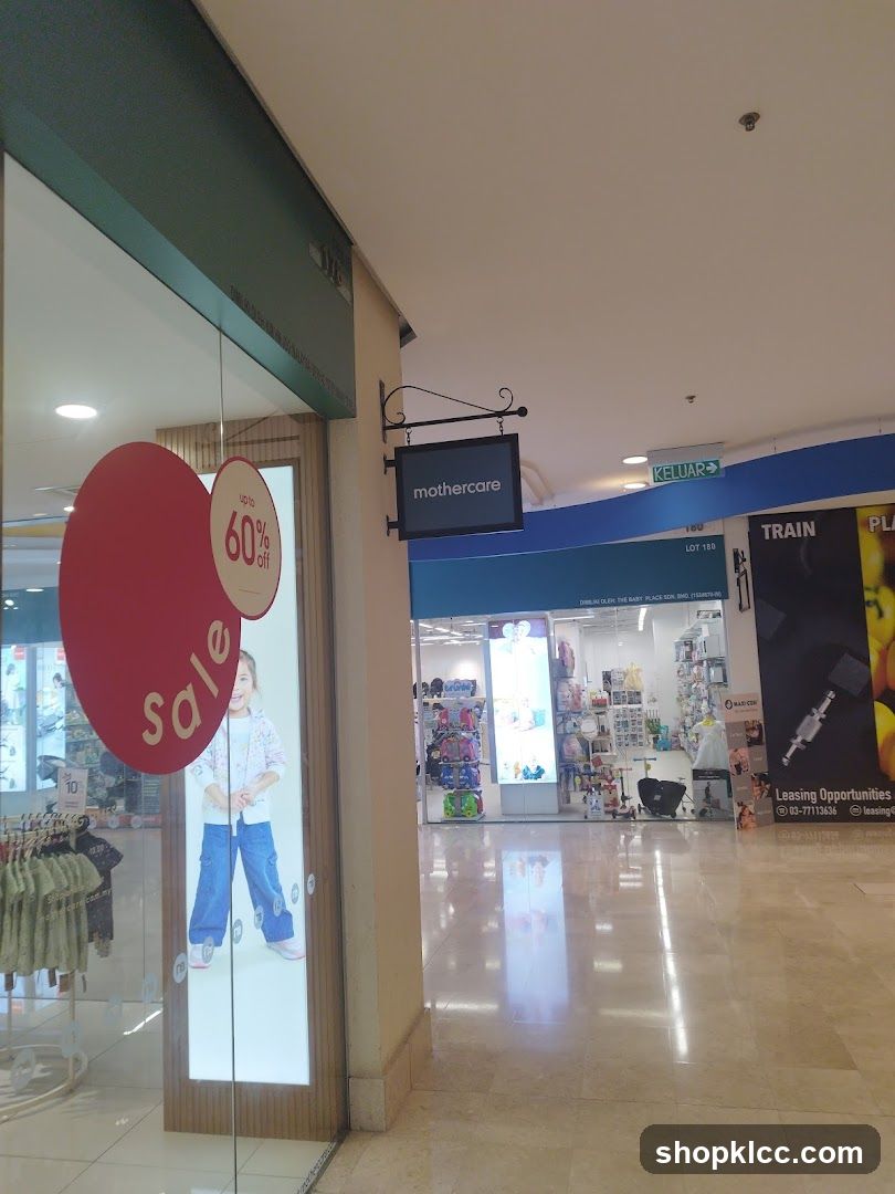 Shopping Mall Interior with Storefronts and Advertisements