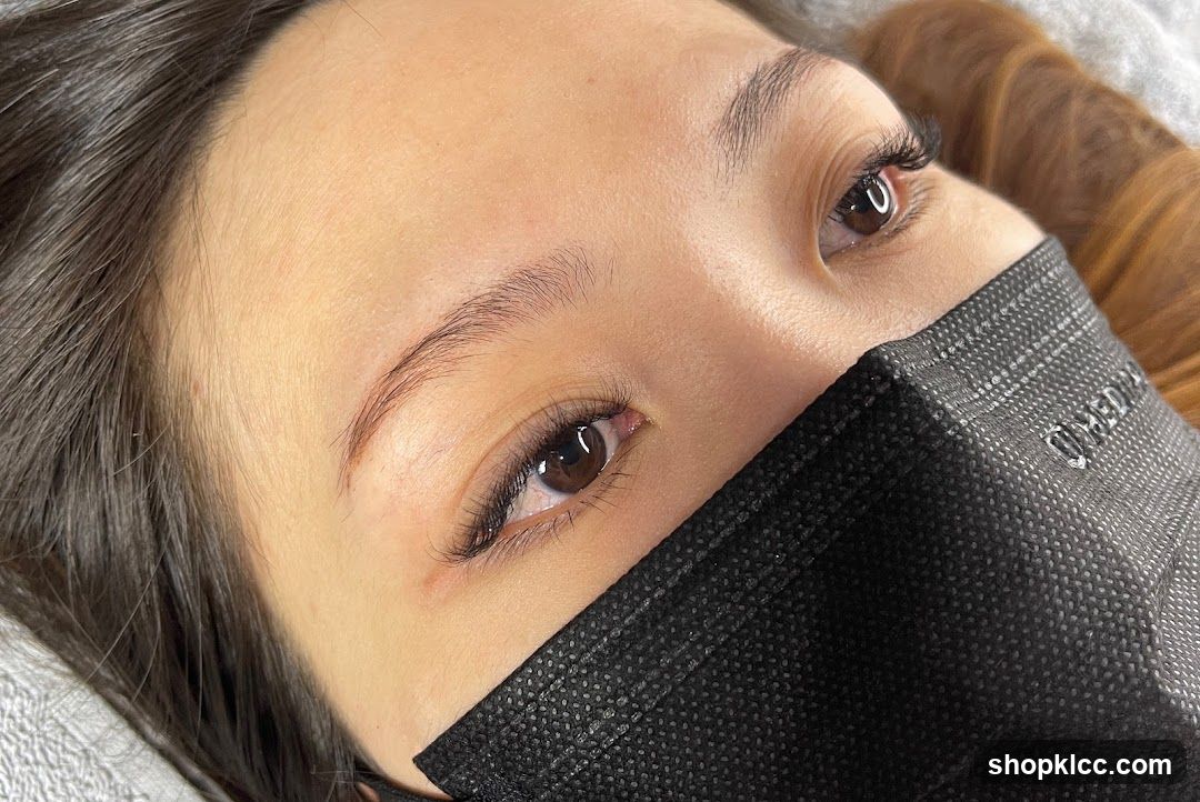 Close-up of a person's face wearing a black mask