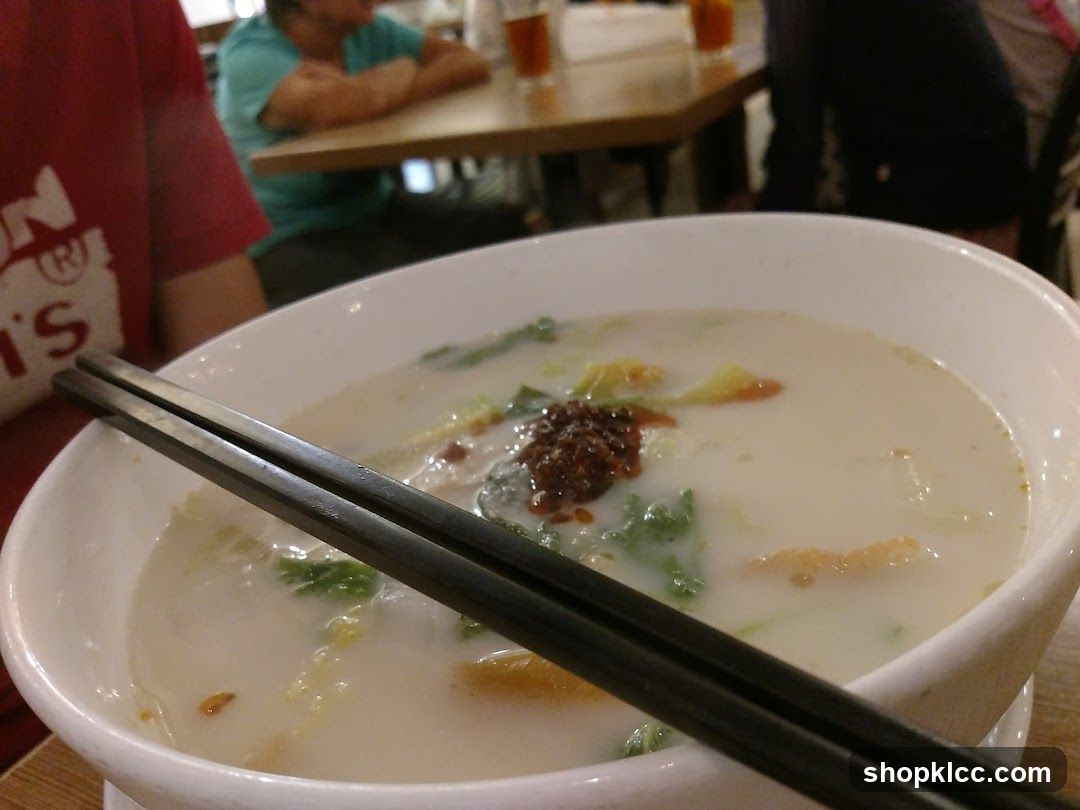 Bowl of Soup with Chopsticks