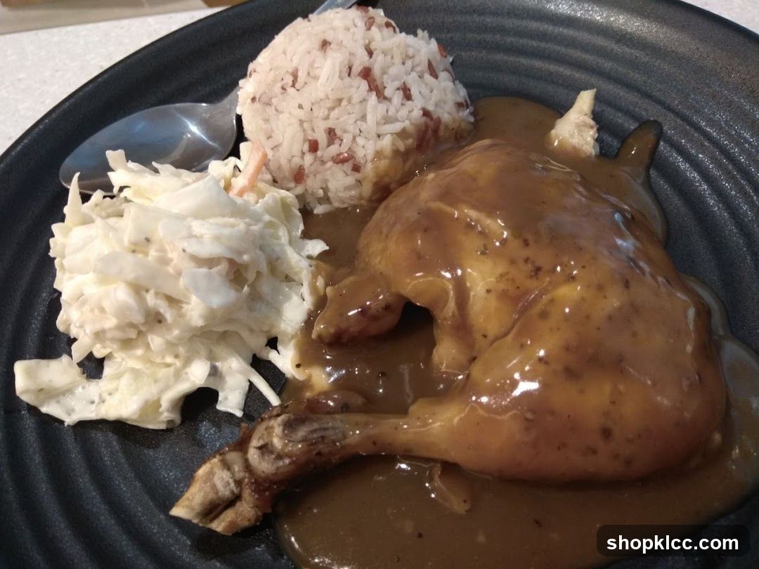 Chicken dish with rice and coleslaw