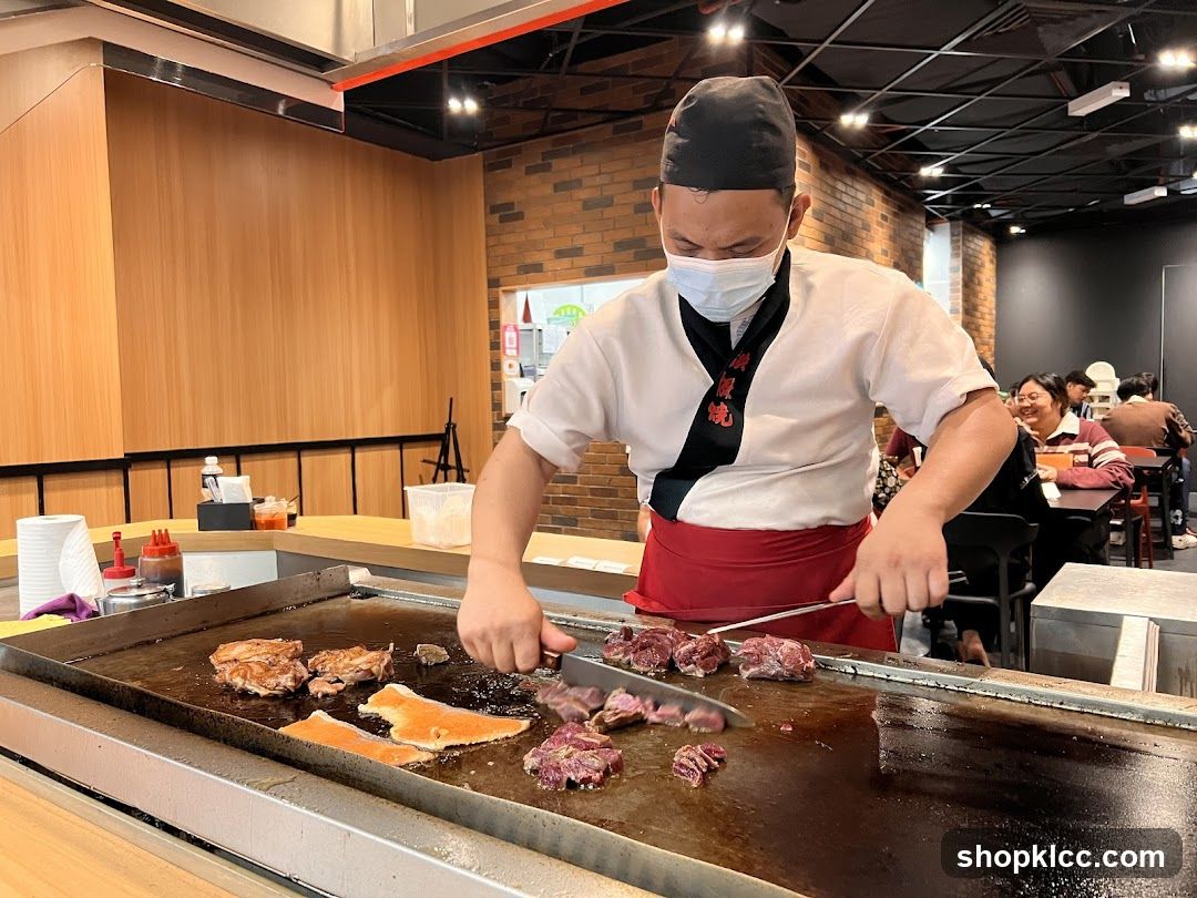 Chef cooking meat on a grill