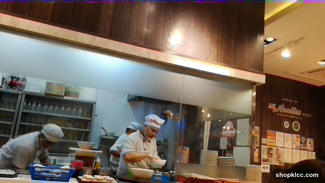 Chefs preparing food in a restaurant kitchen