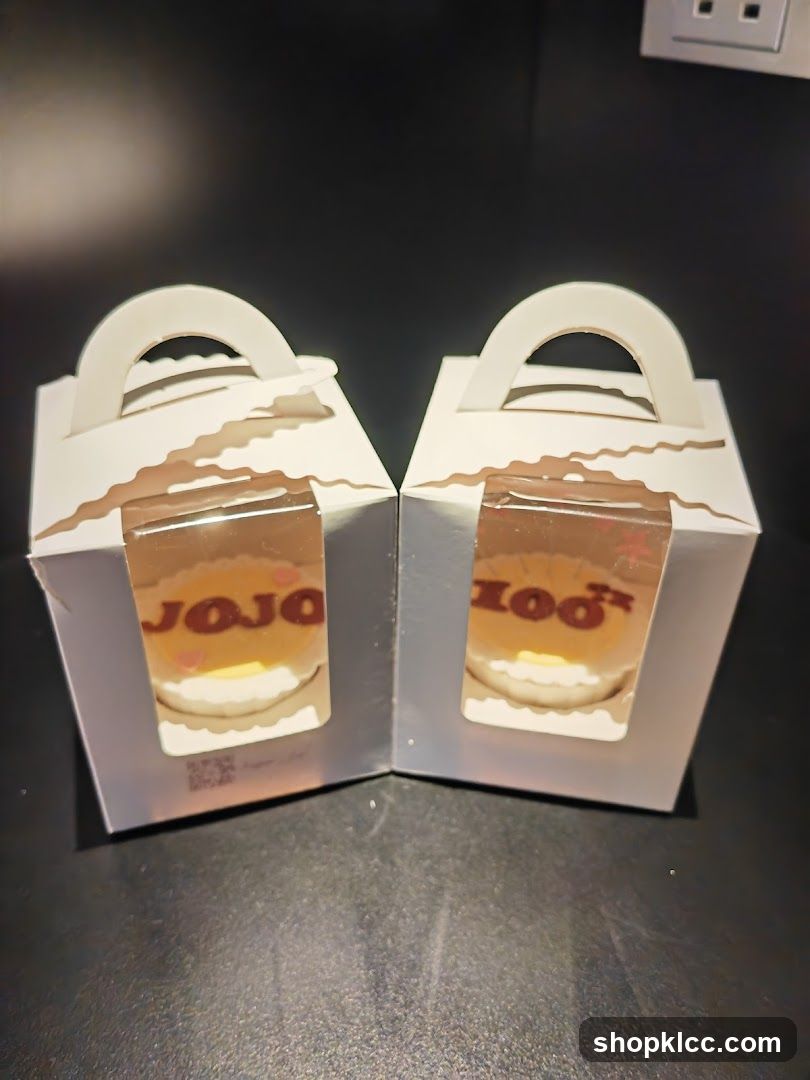 Two small cakes in gift boxes