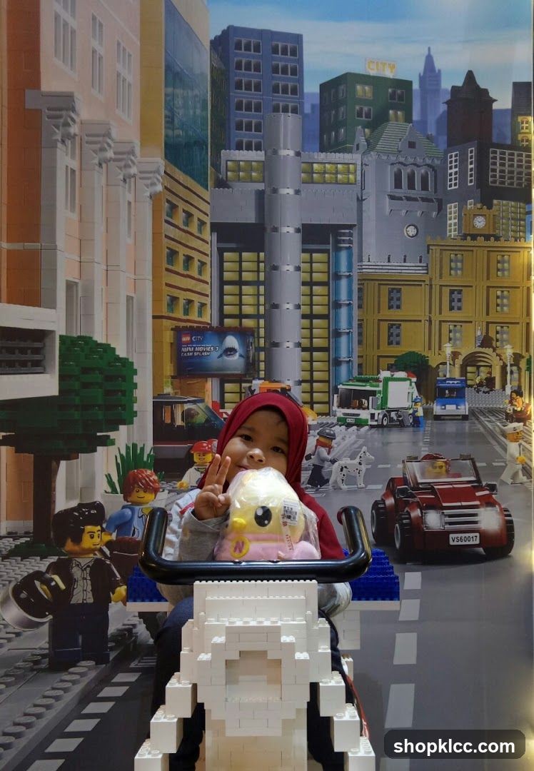 Child Poses with Lego City Backdrop
