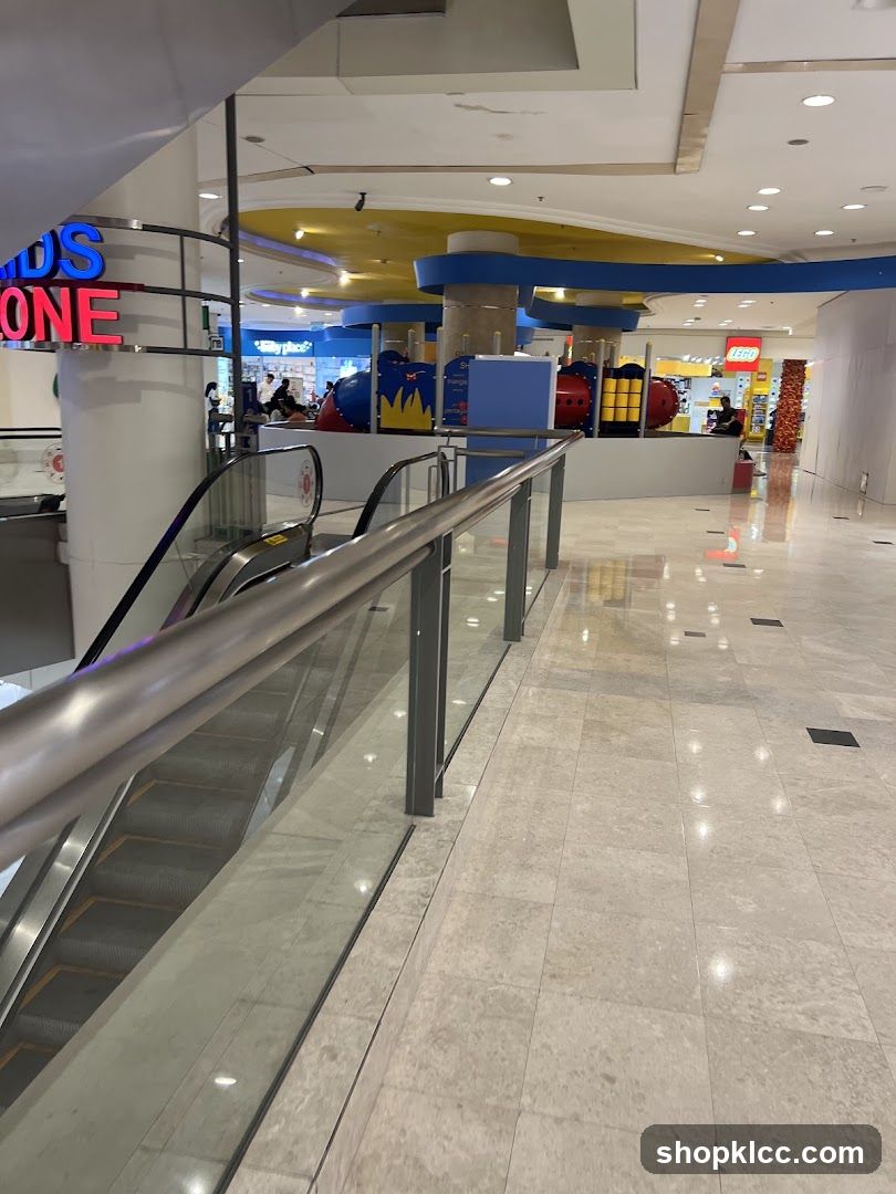 Indoor shopping mall with escalators and play area