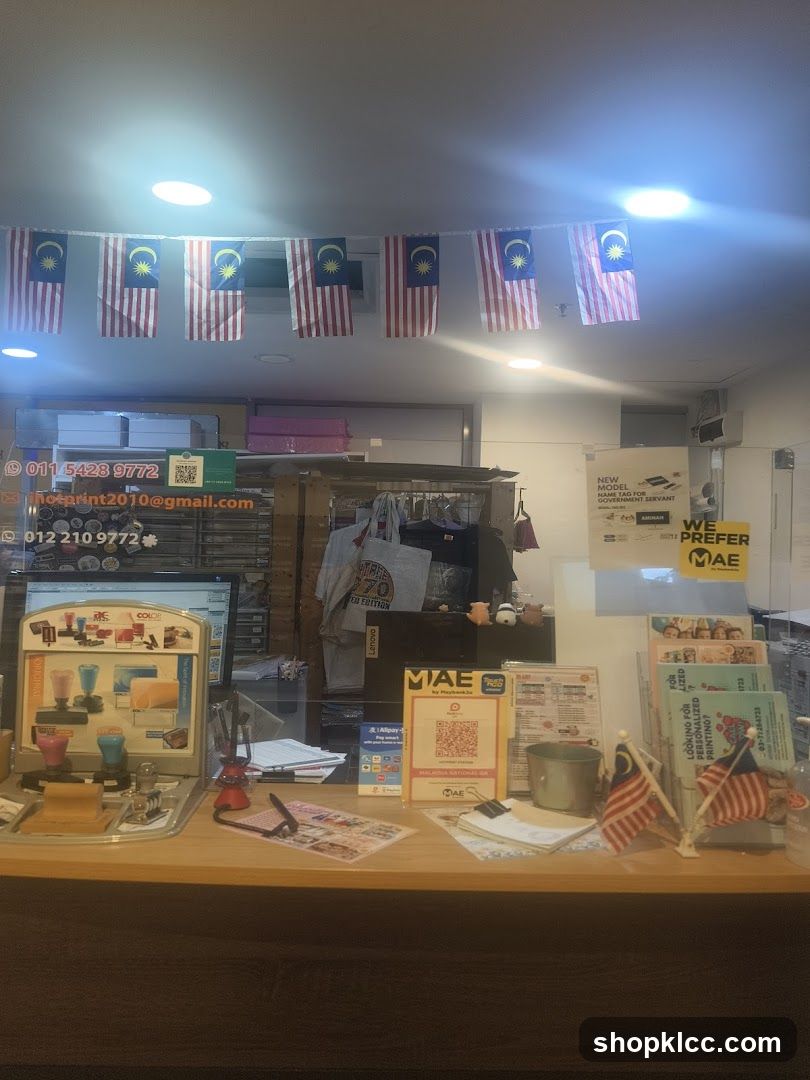 Interior of a shop with Malaysian flags and promotional materials