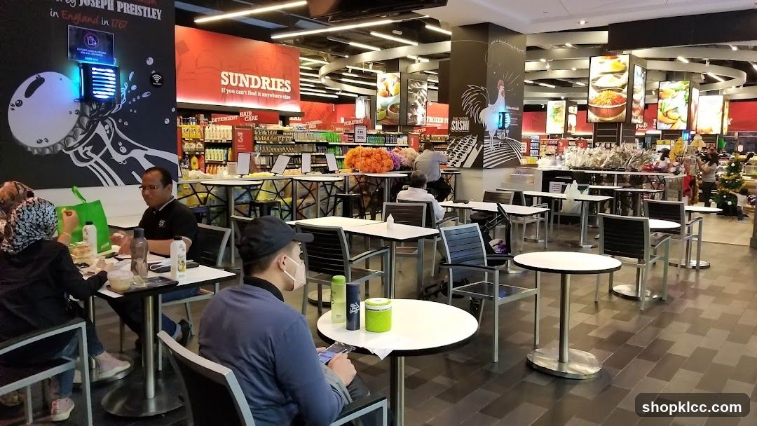 Indoor seating area with retail shelves in the background